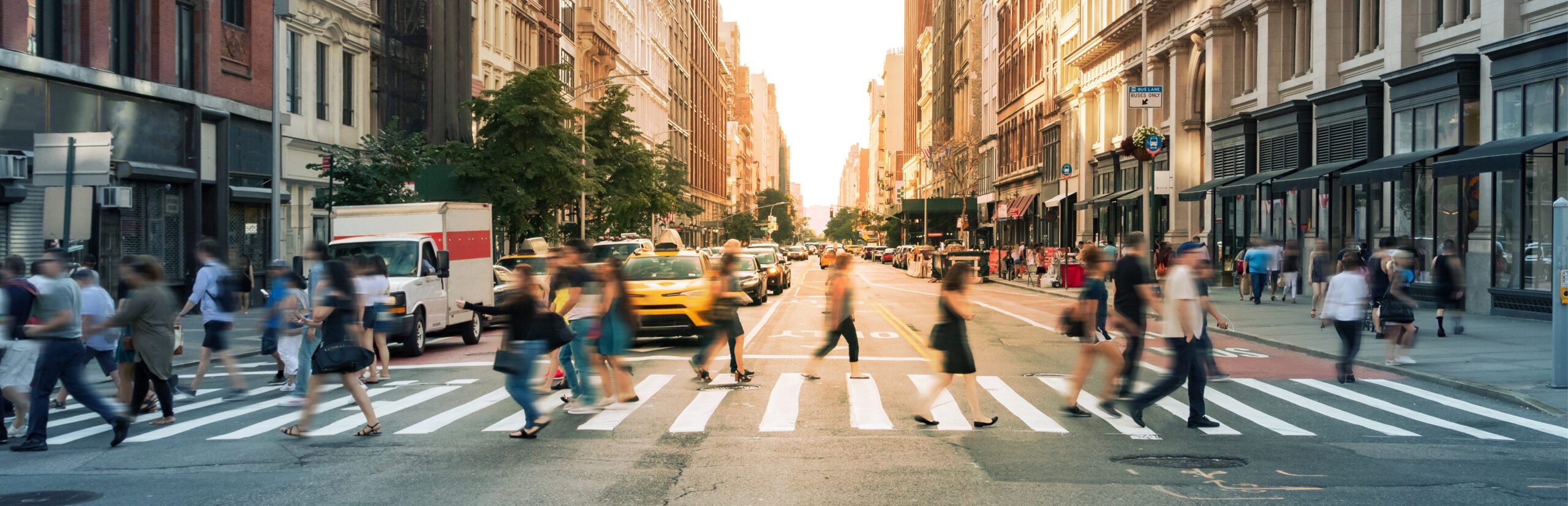 Human-factors-(web) Pedestrians walking across busy street on a crosswalk